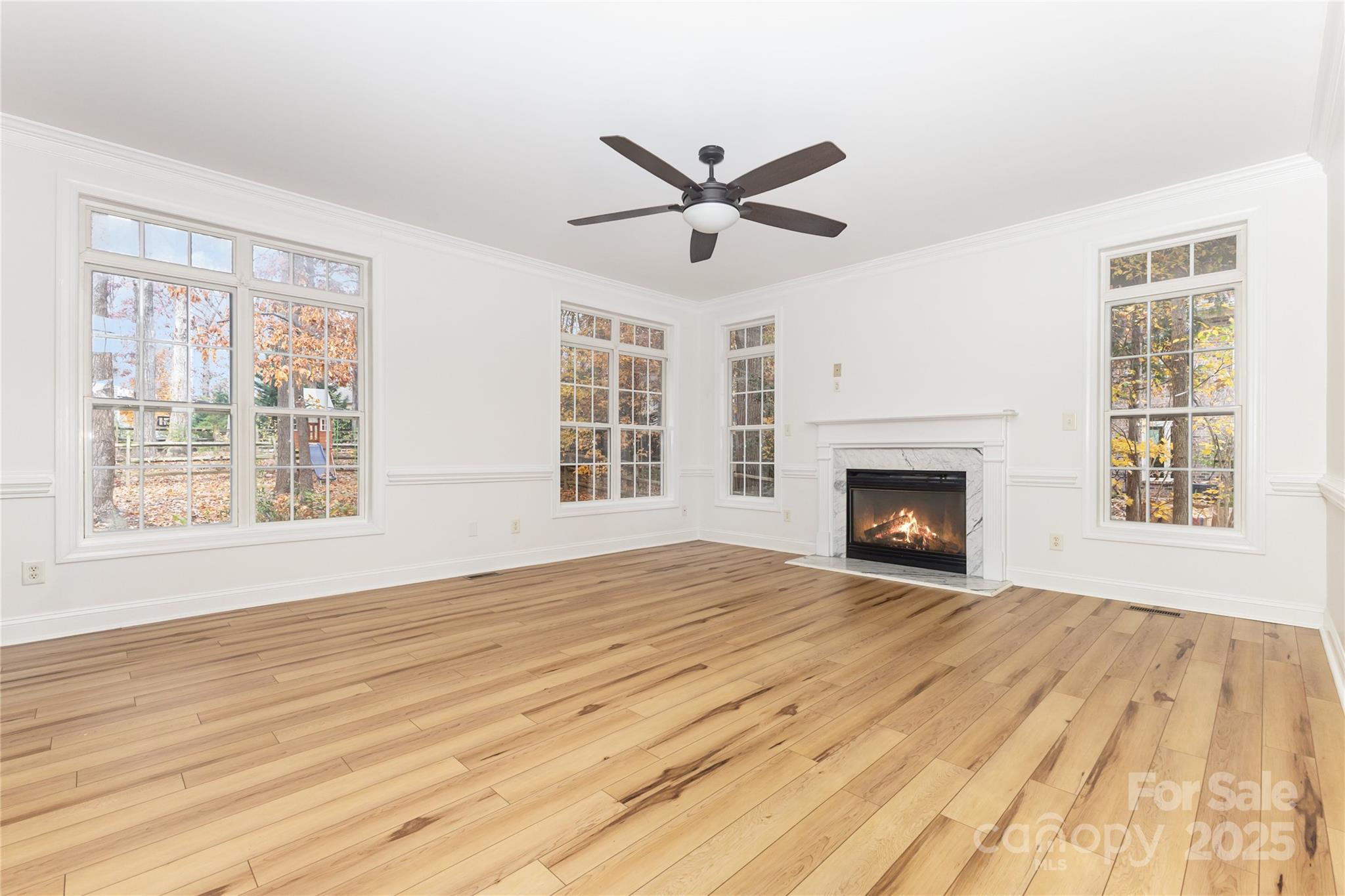 884 Clonmel Drive Matthews, NC 28104 - Photo 8 of 48 a view of empty room with wooden floor and fan
