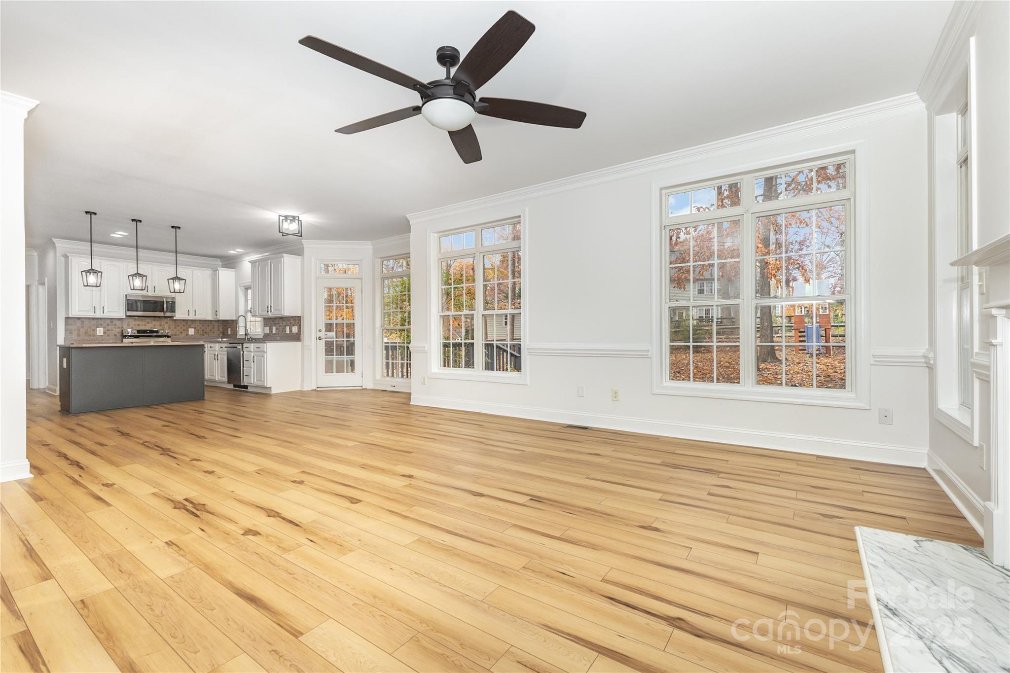 884 Clonmel Drive Matthews, NC 28104 - Photo 9 of 48 a view of an empty room with a kitchen and a window