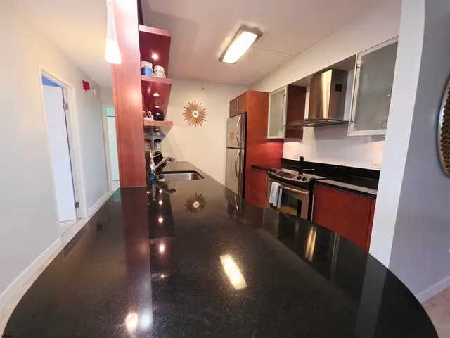a view of a livingroom with furniture and staircase