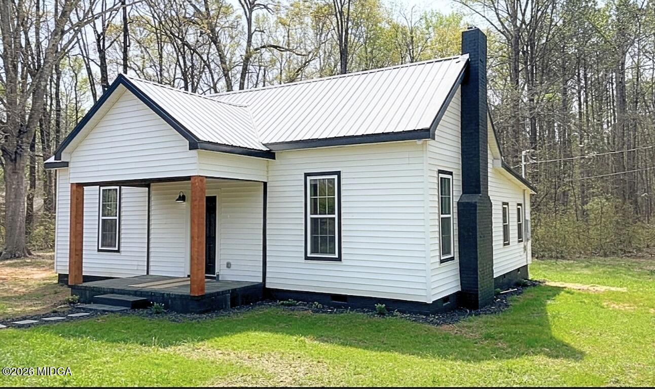 3181 Dames Ferry Road Forsyth, GA 31029 - Photo 1 of 36 a view of a house with a yard and wooden floor
