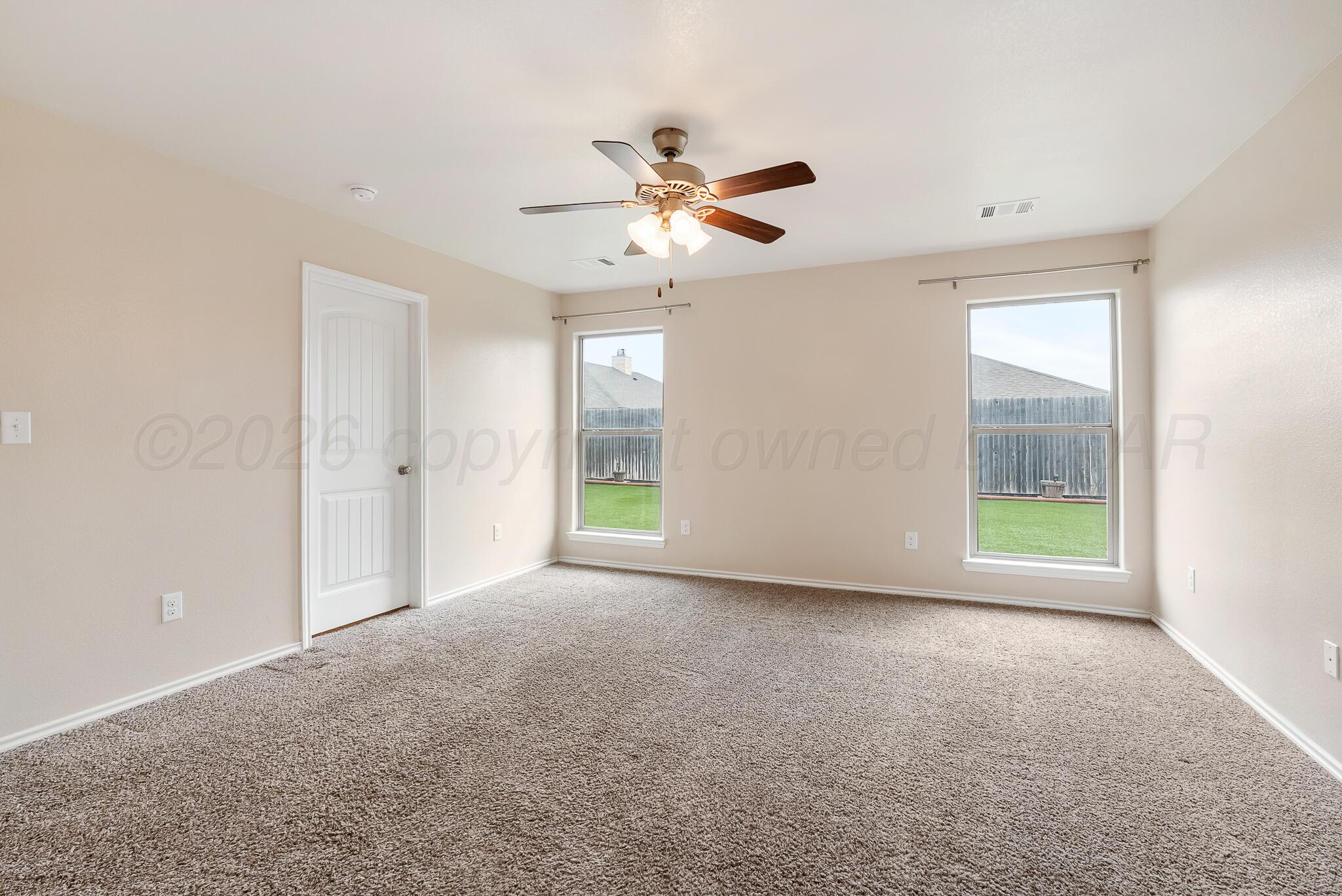4807 Eberly Street Amarillo, TX 79118 - Photo 16 of 25 a view of an empty room with a window