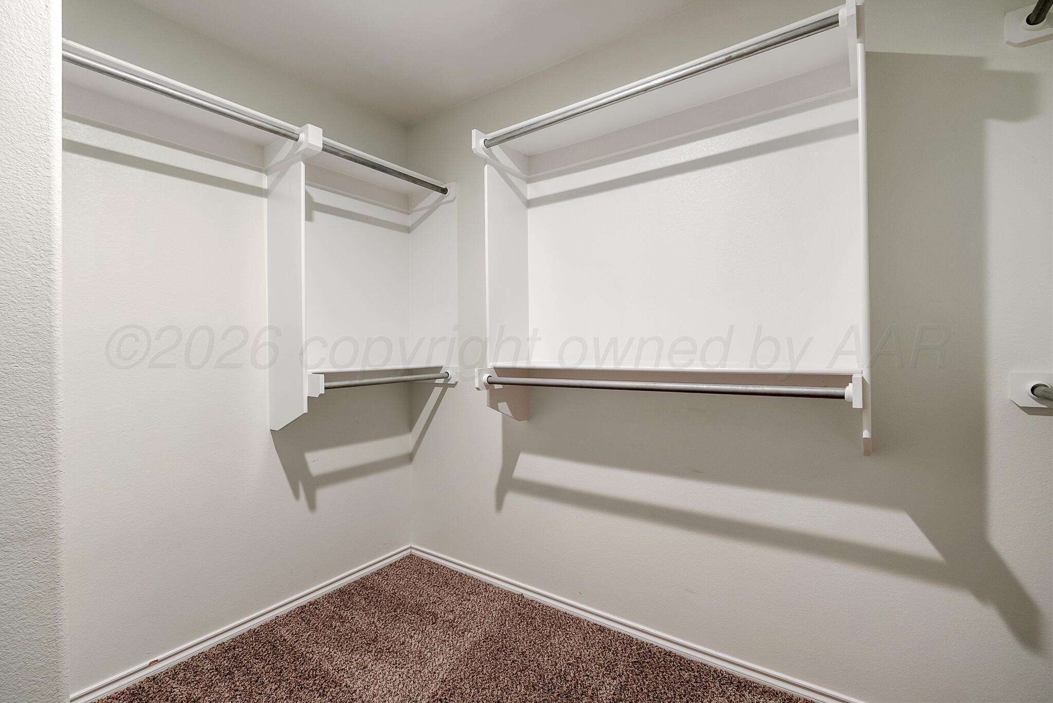 4807 Eberly Street Amarillo, TX 79118 - Photo 18 of 25 a bathroom with a glass shower door
