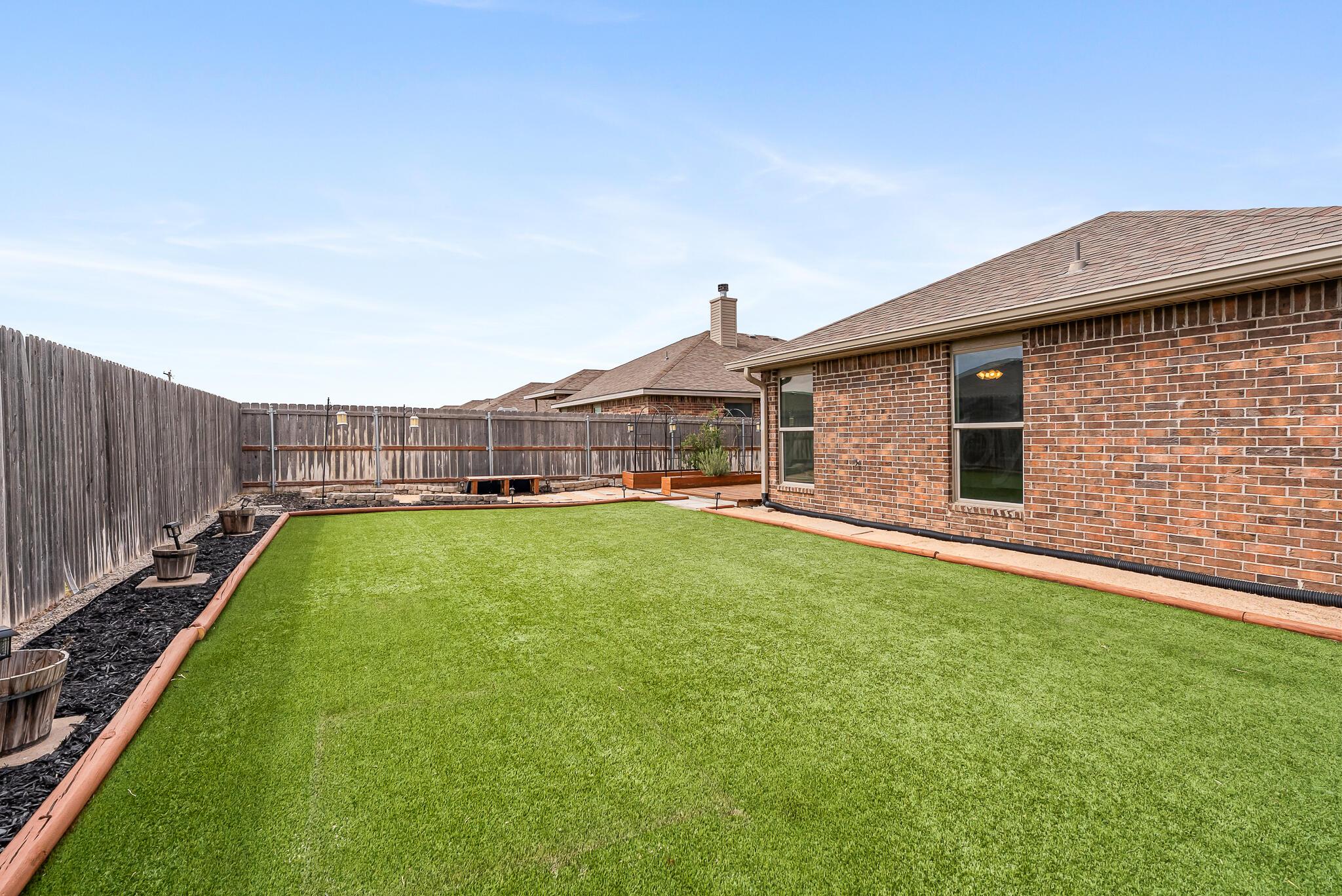 4807 Eberly Street Amarillo, TX 79118 - Photo 5 of 25 a view of a house with a backyard
