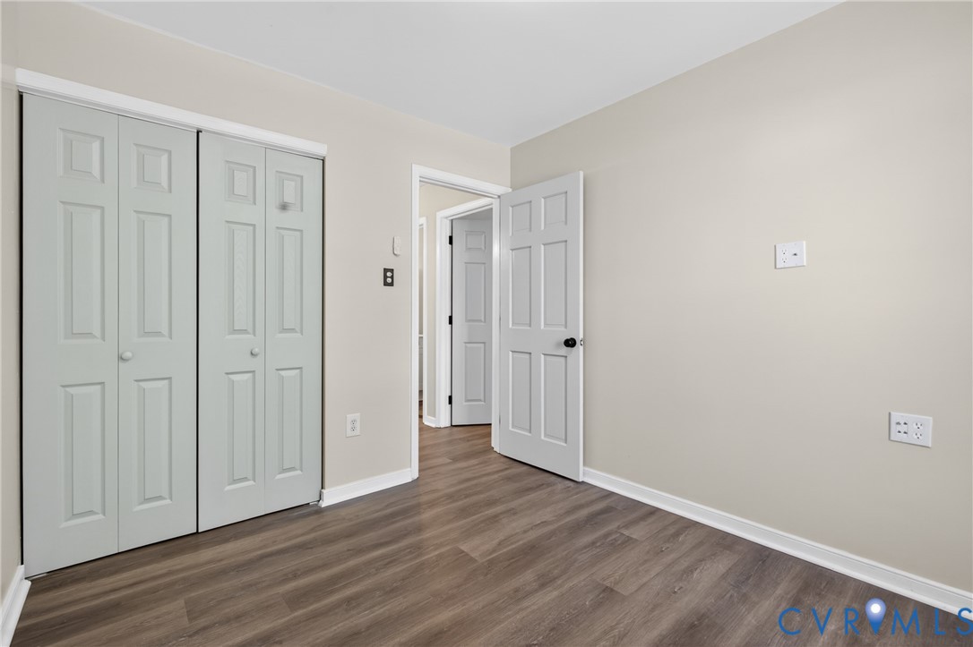 10050 Purcell Road Richmond, VA 23228 - Photo 19 of 26 a view of a hallway with wooden floor