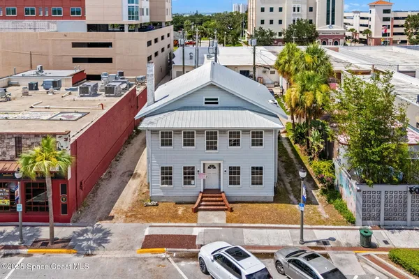 a aerial view of a house with swimming pool