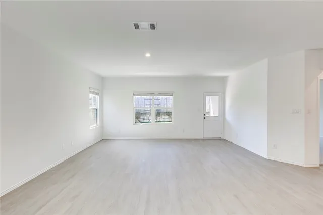 an empty room with windows