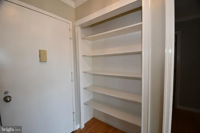 a bathroom with a double vanity sink and mirror with shower