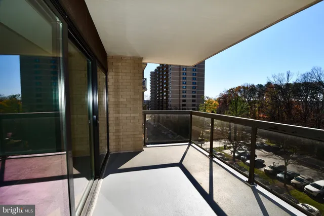 a living room with furniture pool table and a large window