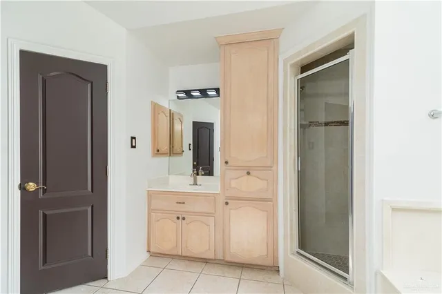 a room with a window and a refrigerator