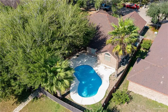 a view of a swimming pool with a backyard