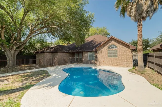 a view of a two jacuzzi in a backyard
