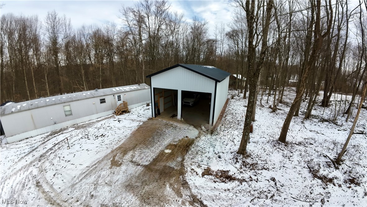 29311 Rabbit Ridge Road Howard, OH 43028 - Photo 32 of 39 Snow covered structure with an outbuilding