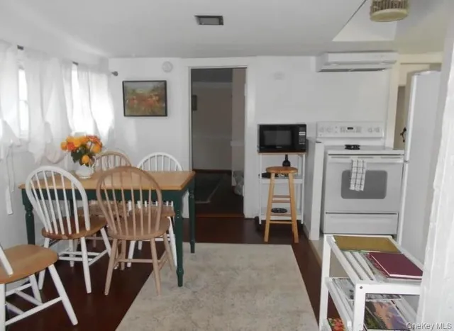 a bedroom with furniture and a tv