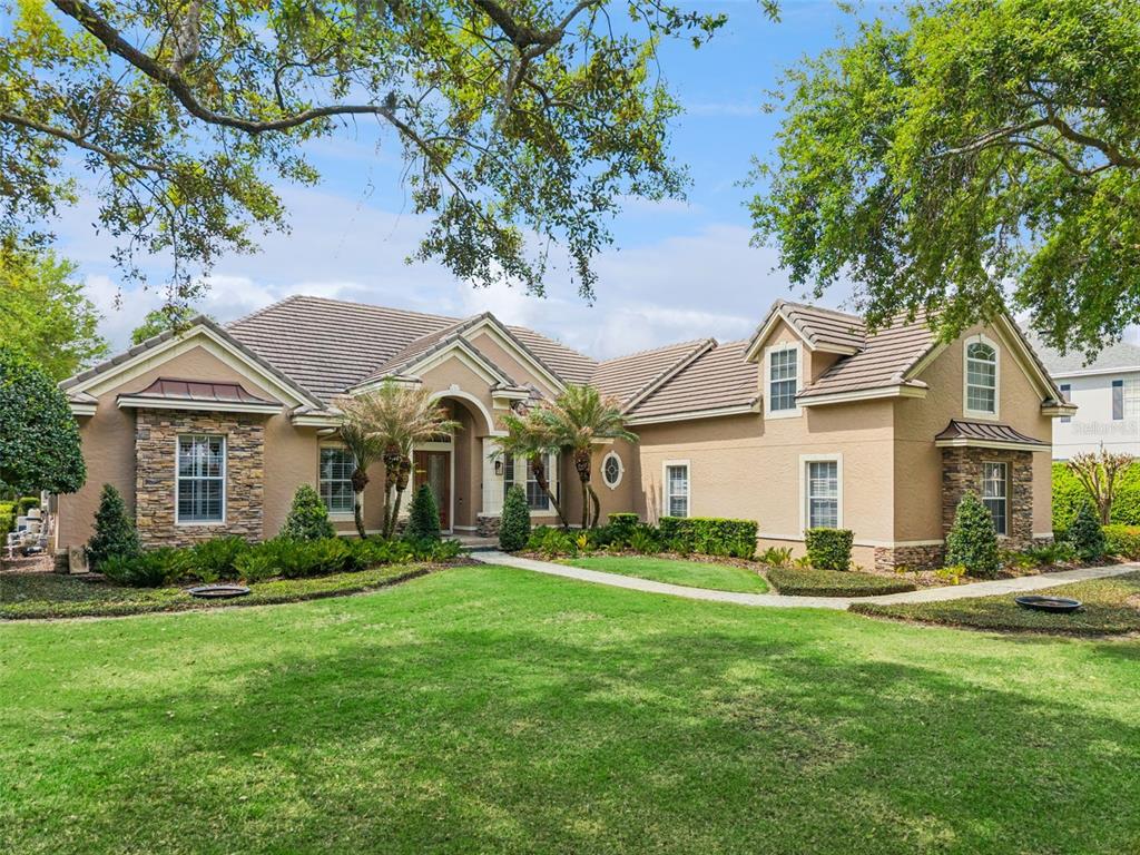 a front view of house with yard and green space