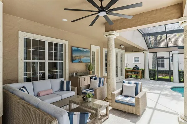 a view of a house with sitting area and garden