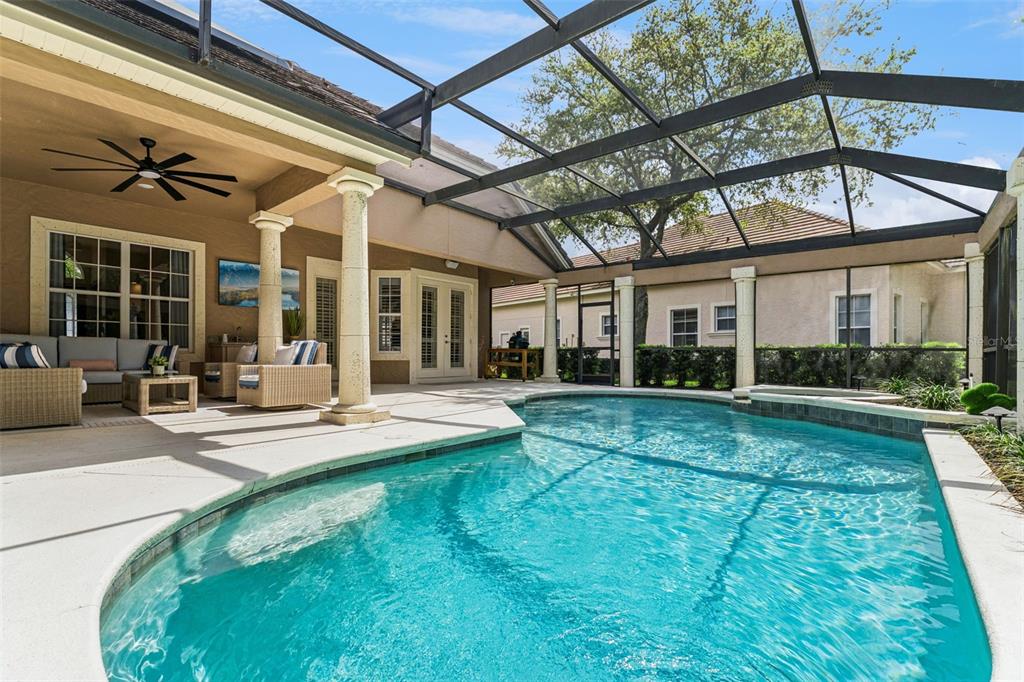 6110 Keenes Pointe Drive Windermere, FL 34786 - Photo 12 of 78 a view of a house with sitting area and garden