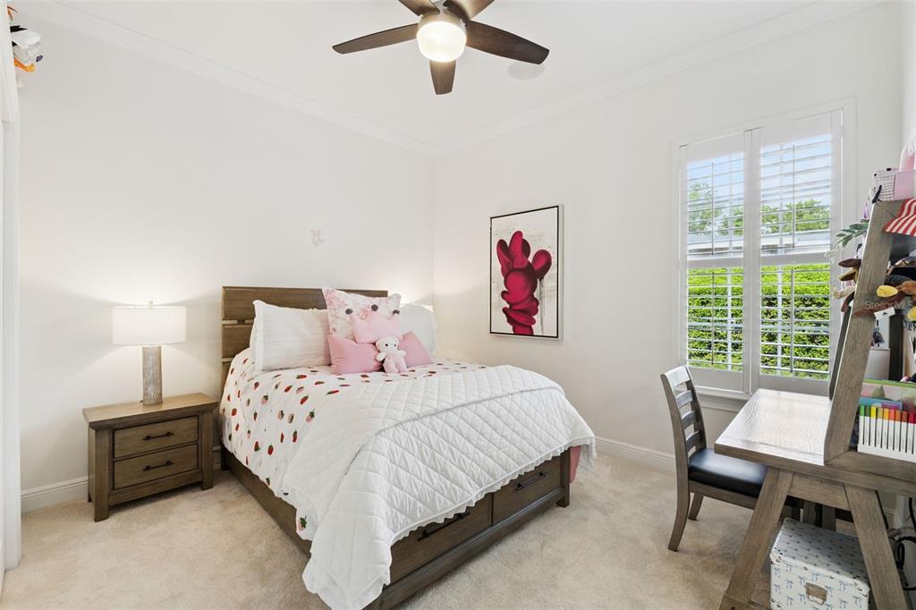 6110 Keenes Pointe Drive Windermere, FL 34786 - Photo 15 of 78 a bedroom with a bed and a desk