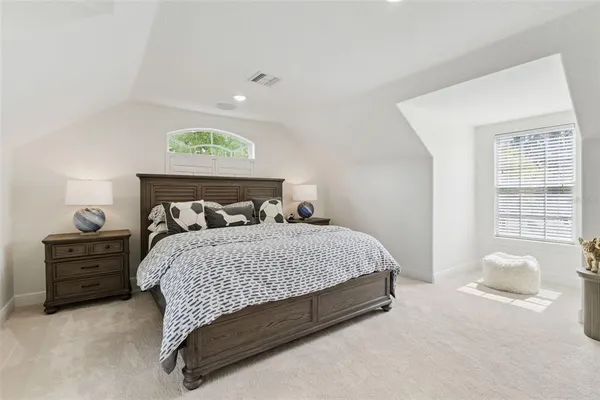 a kitchen with kitchen island white cabinets and white appliances
