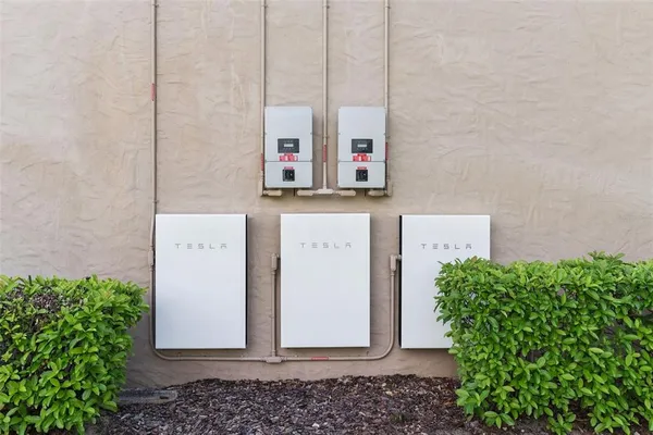 a kitchen with kitchen island a sink and a chandelier