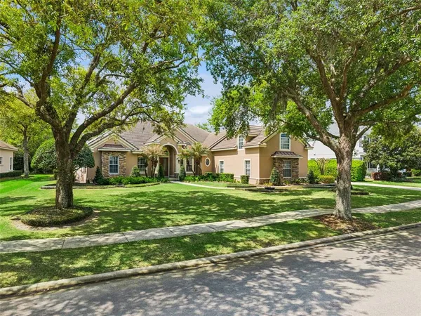 a view of a dining room with furniture large window chandelier and wooden floor