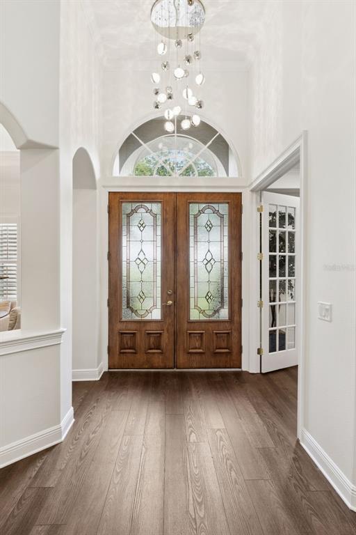 6110 Keenes Pointe Drive Windermere, FL 34786 - Photo 23 of 78 wooden floor in an empty room with a window