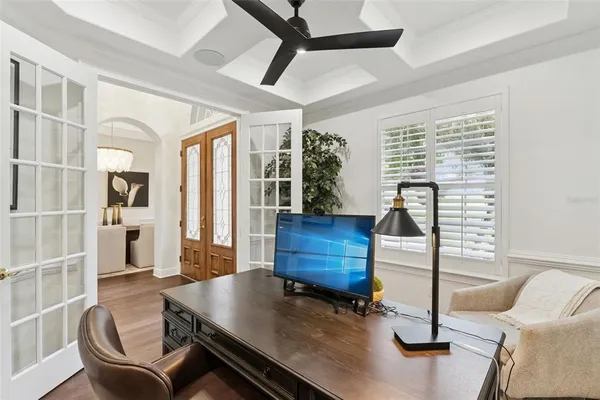 a bedroom with a bed and ceiling fan
