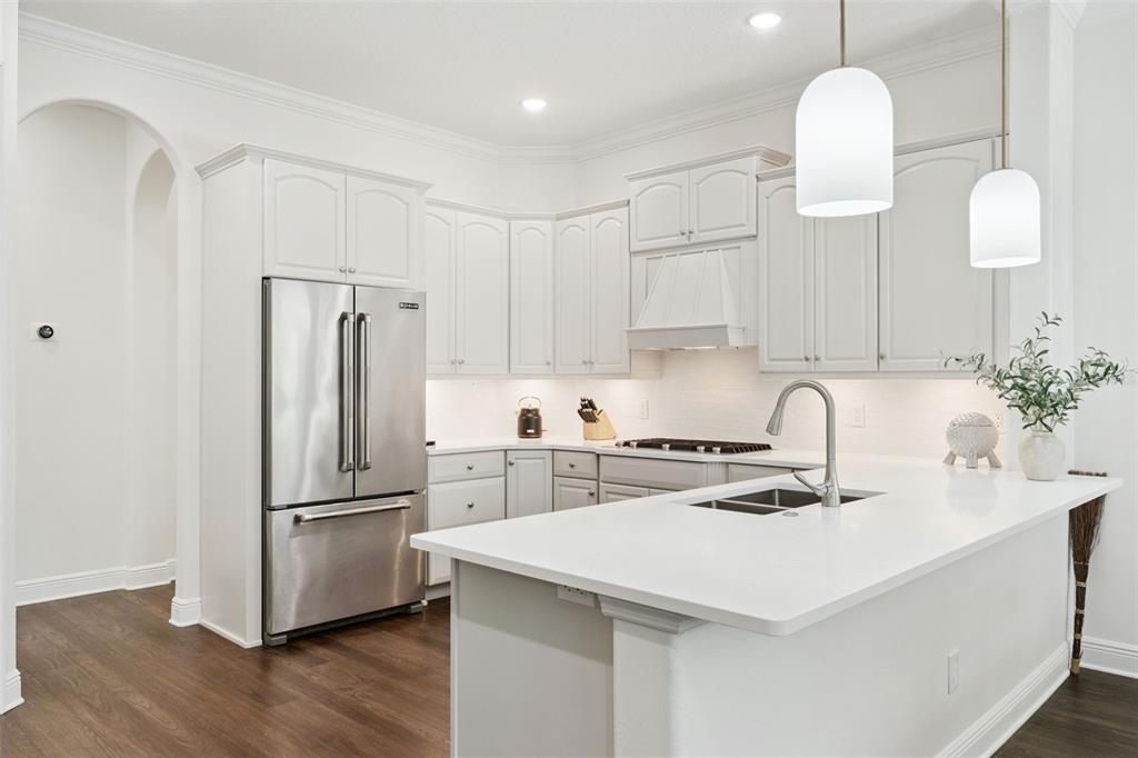 6110 Keenes Pointe Drive Windermere, FL 34786 - Photo 28 of 78 a kitchen with stainless steel appliances a stove a sink a refrigerator and cabinets