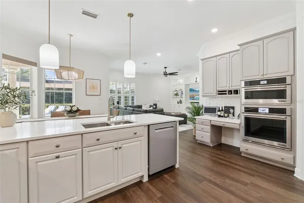 a view of a house with sitting area and a swimming pool