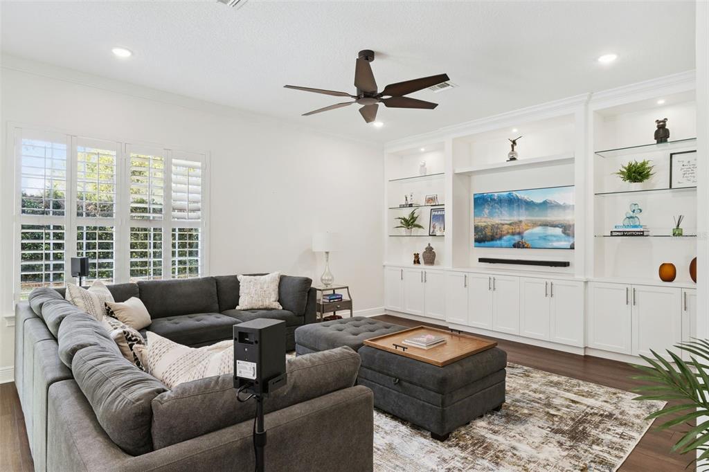 6110 Keenes Pointe Drive Windermere, FL 34786 - Photo 32 of 78 a living room with furniture and a flat screen tv