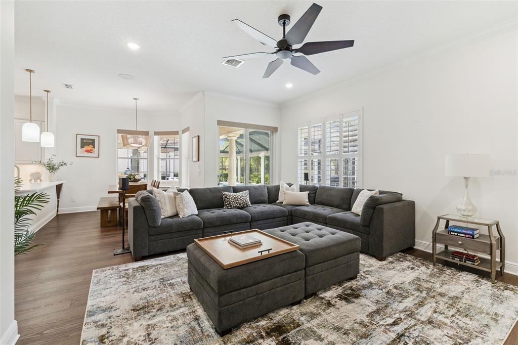 6110 Keenes Pointe Drive Windermere, FL 34786 - Photo 33 of 78 a living room with furniture and a wooden floor