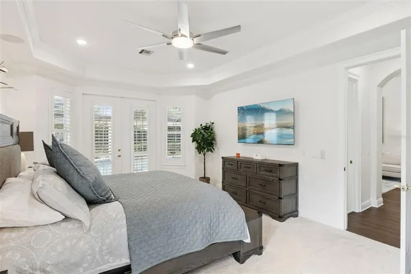 an aerial view of residential houses with outdoor space and trees