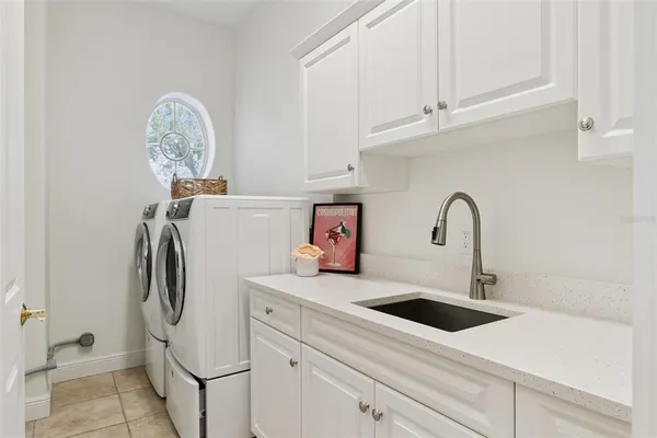 an aerial view of residential houses with outdoor space and swimming pool