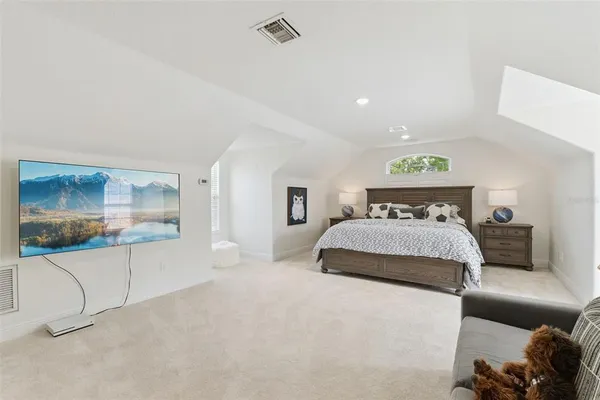 an aerial view of a house with garden space and street view