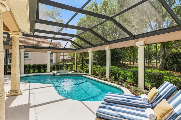 an aerial view of a house with a garden and trees