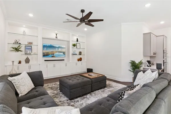 a view of a room with wooden floor and windows