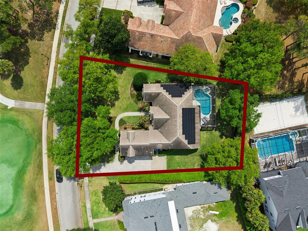 6110 Keenes Pointe Drive Windermere, FL 34786 - Photo 63 of 78 an aerial view of a house with a garden and trees
