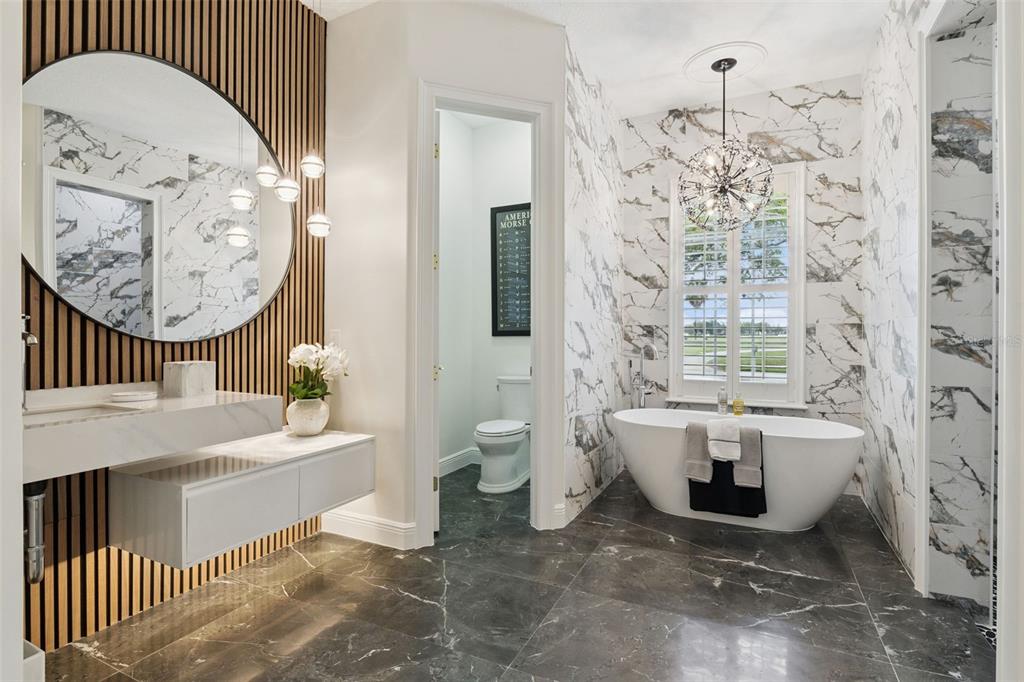 6110 Keenes Pointe Drive Windermere, FL 34786 - Photo 10 of 78 a bathroom with a sink a toilet and bathtub