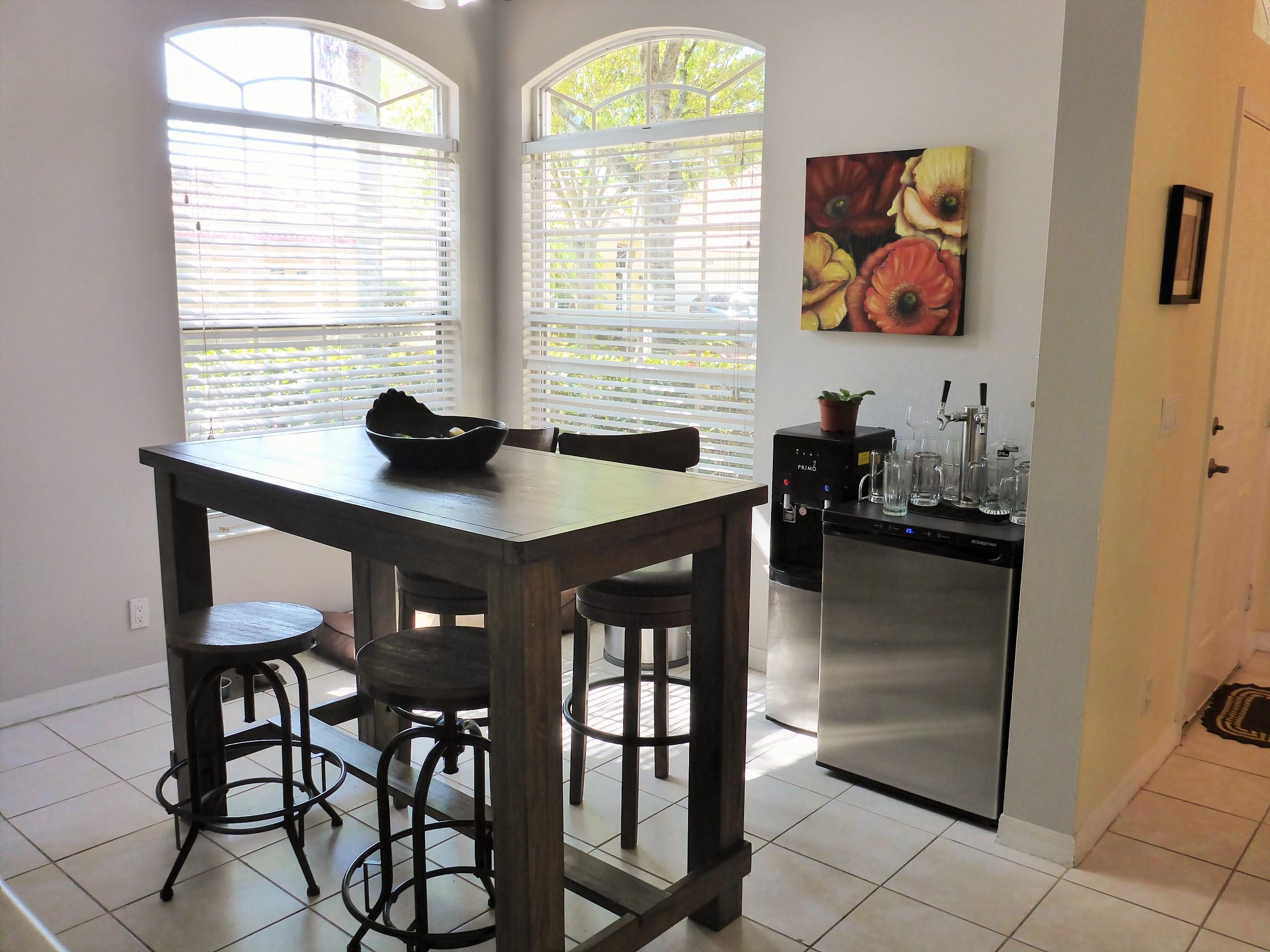 5124 Elpine Way Riviera Beach, FL 33418 - Photo 15 of 45 a view of a dining room with furniture and a window