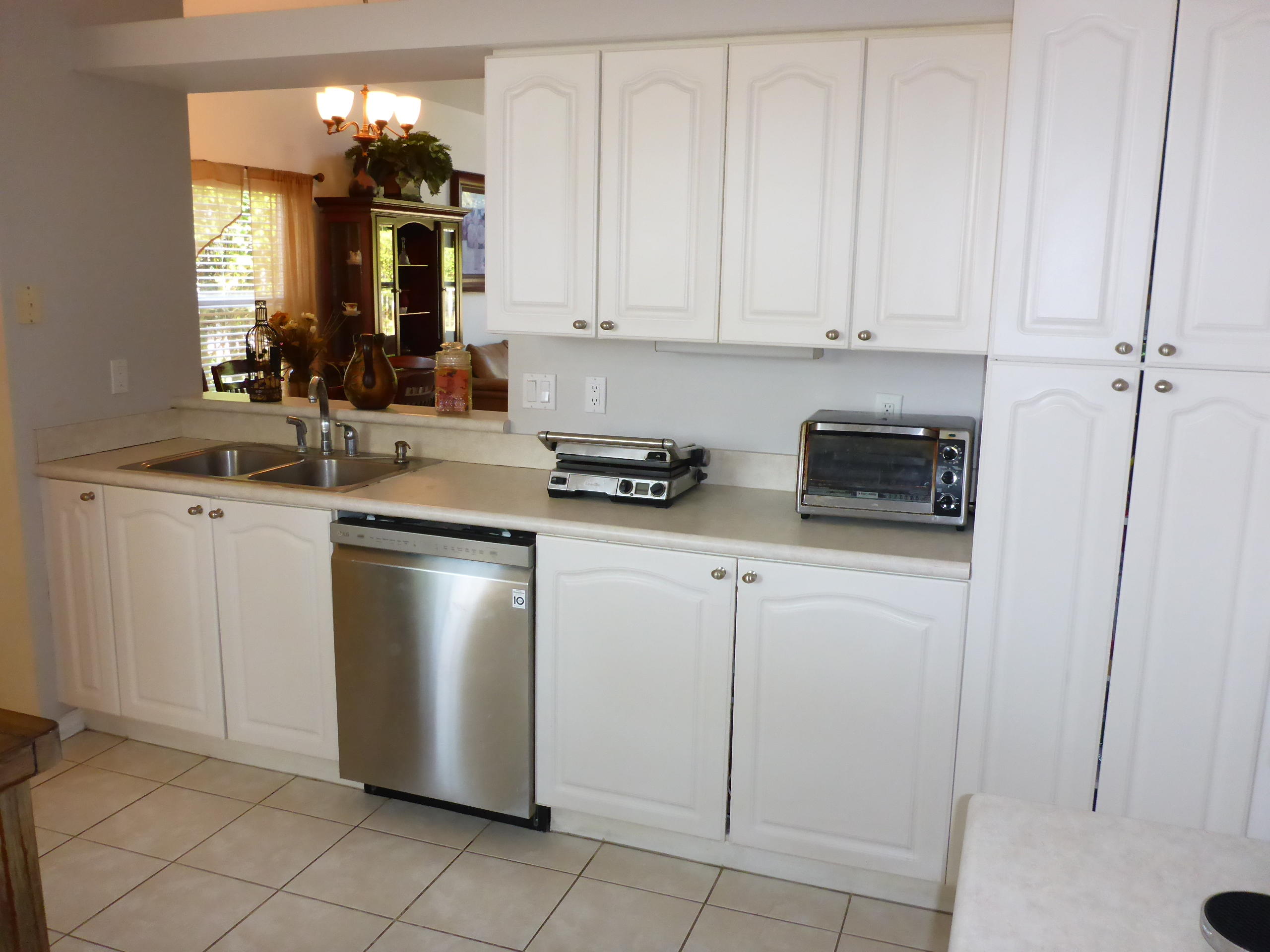 5124 Elpine Way Riviera Beach, FL 33418 - Photo 19 of 45 a kitchen with a sink and cabinets