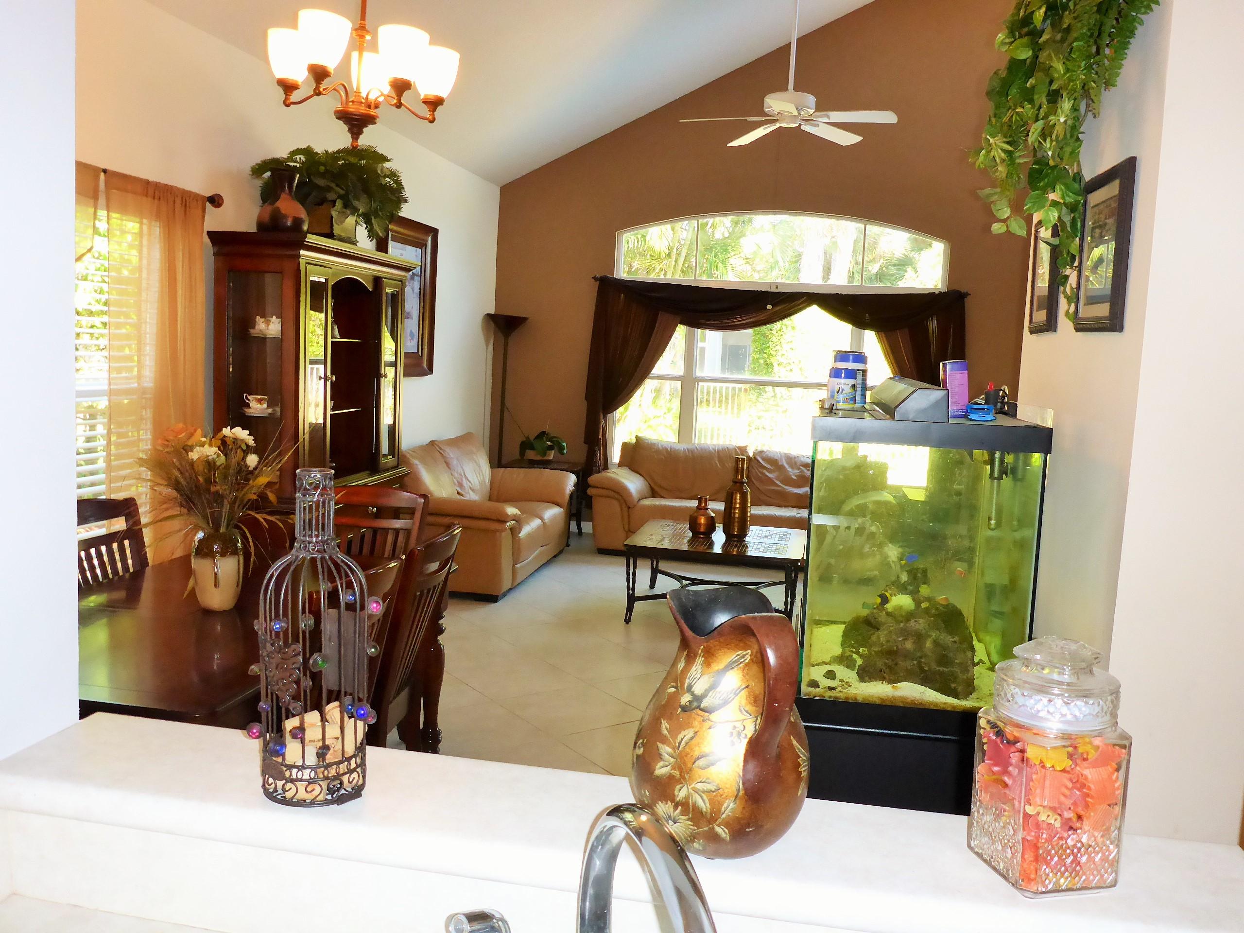 5124 Elpine Way Riviera Beach, FL 33418 - Photo 20 of 45 a dining room with furniture and chandelier kitchen view