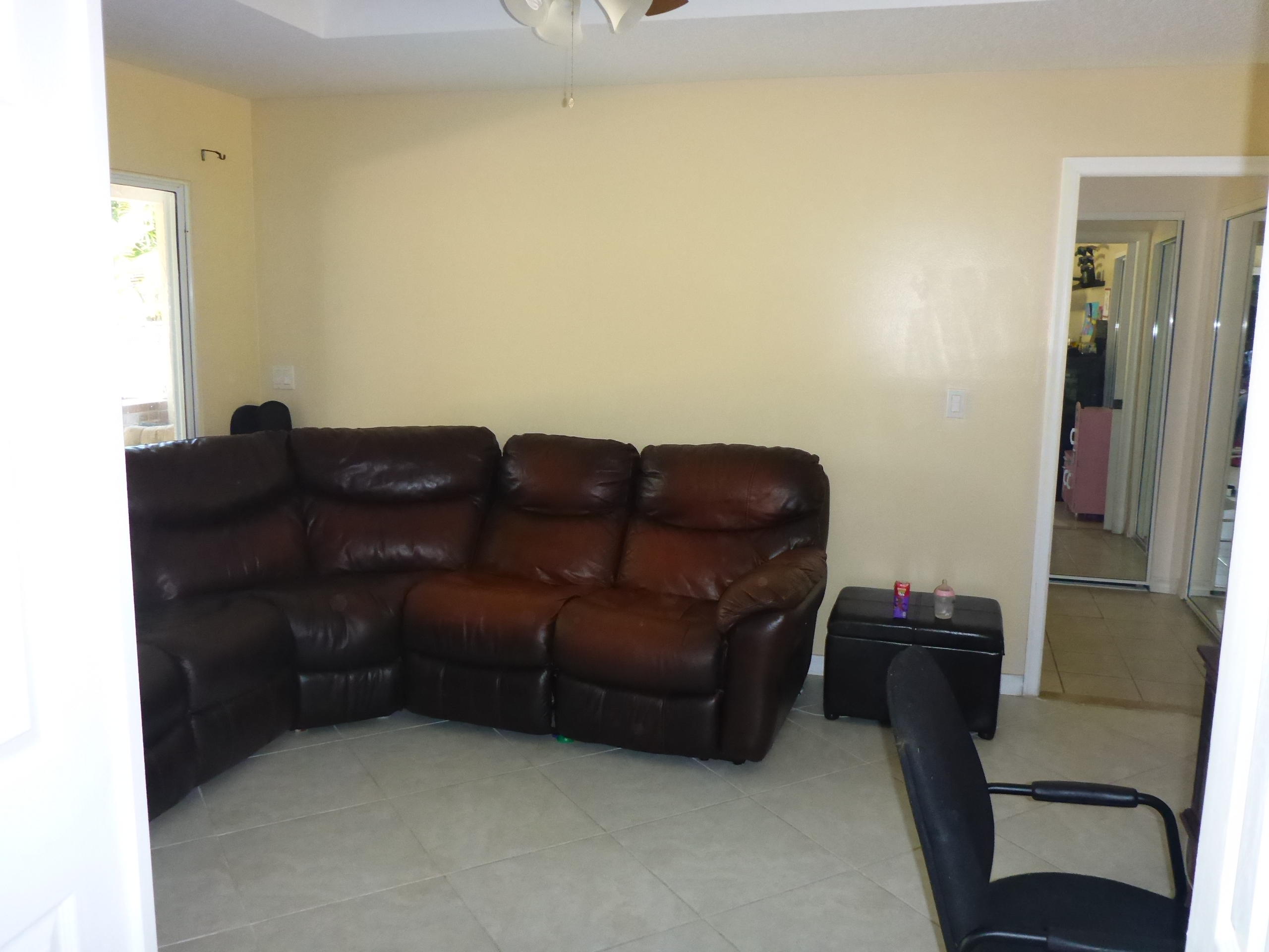 5124 Elpine Way Riviera Beach, FL 33418 - Photo 22 of 45 a living room with furniture