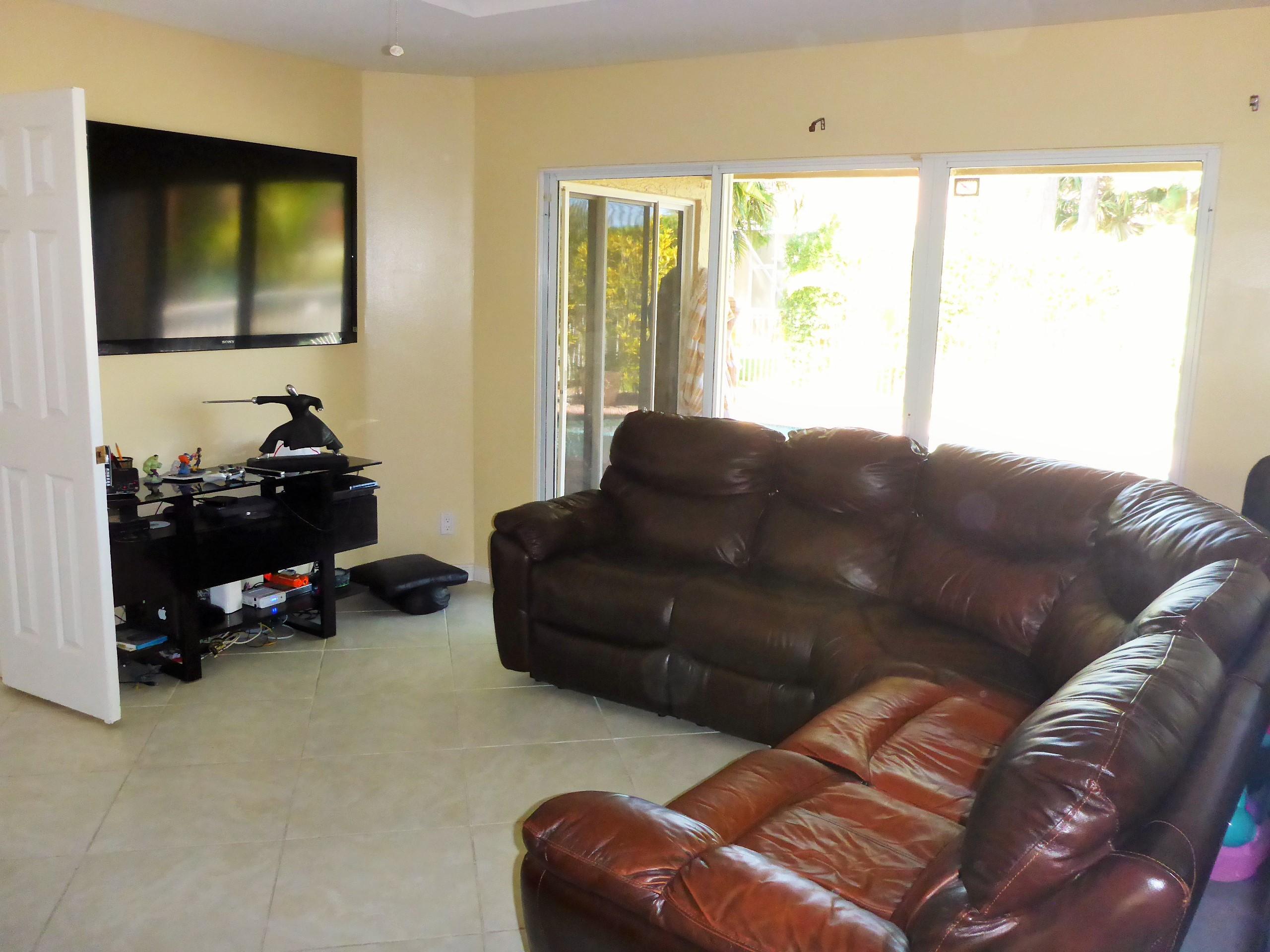 5124 Elpine Way Riviera Beach, FL 33418 - Photo 23 of 45 a living room with furniture and a window