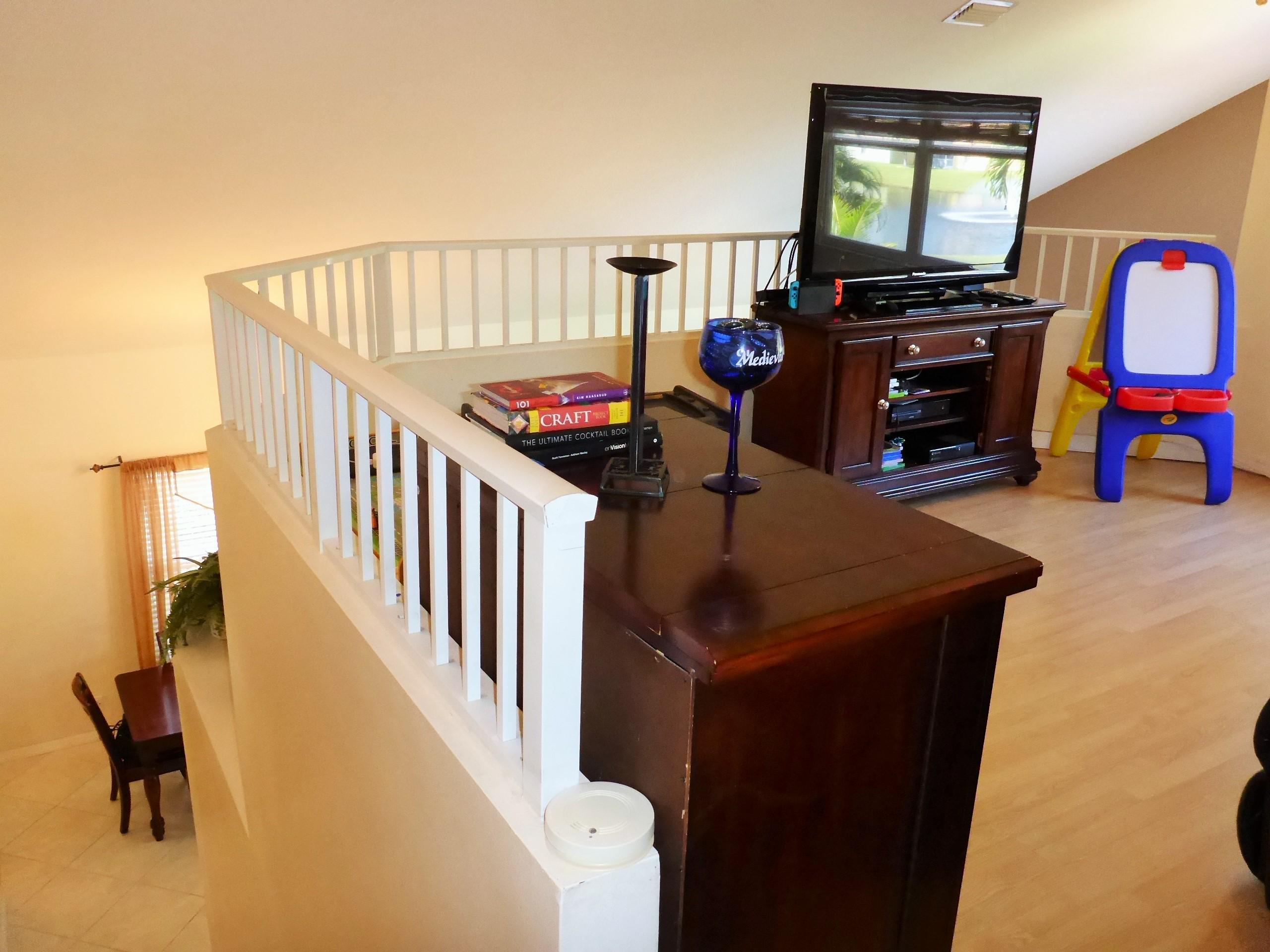 5124 Elpine Way Riviera Beach, FL 33418 - Photo 28 of 45 a living room with furniture and a flat screen tv