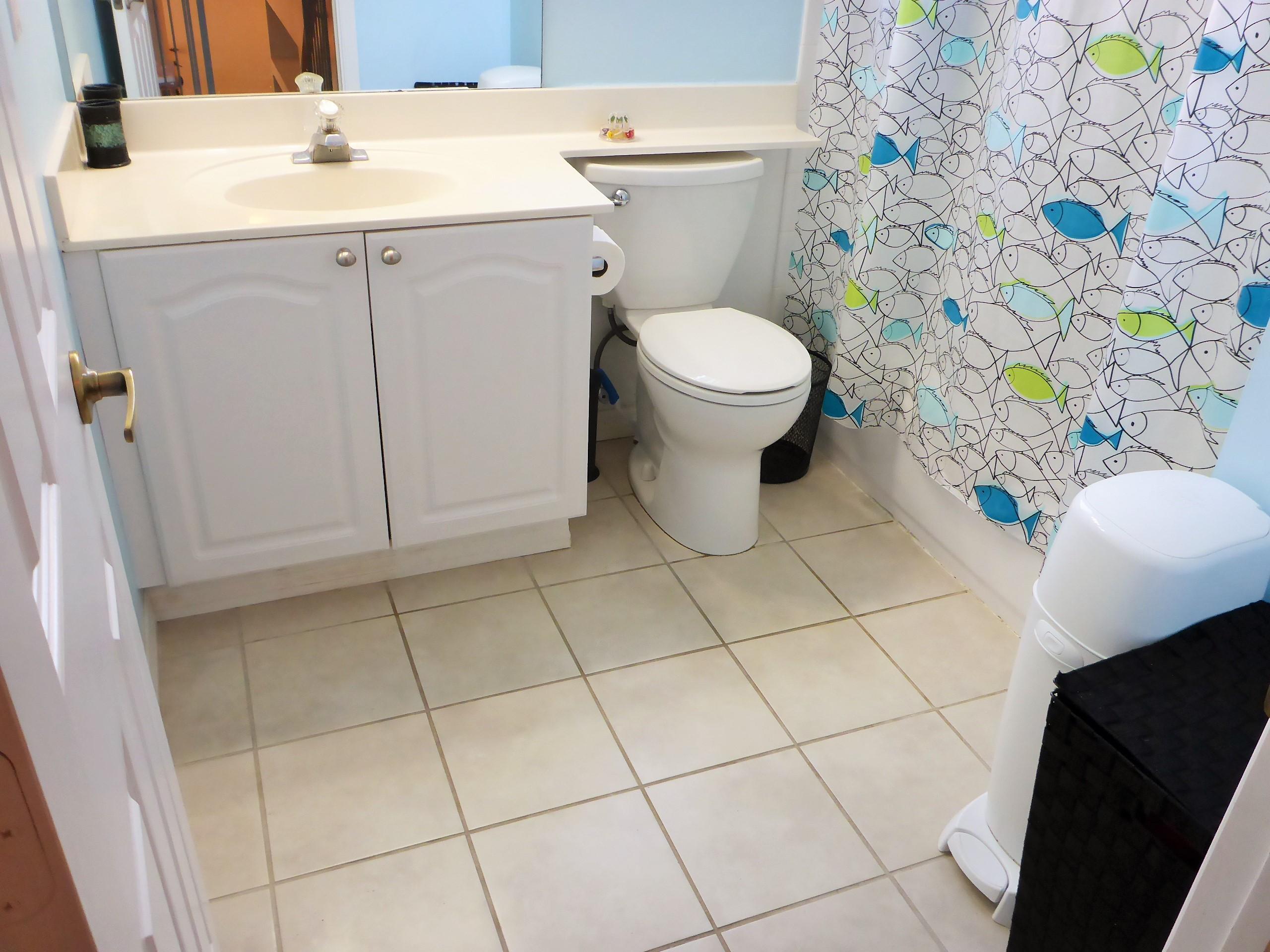 5124 Elpine Way Riviera Beach, FL 33418 - Photo 33 of 45 a white toilet sitting next to a white sink