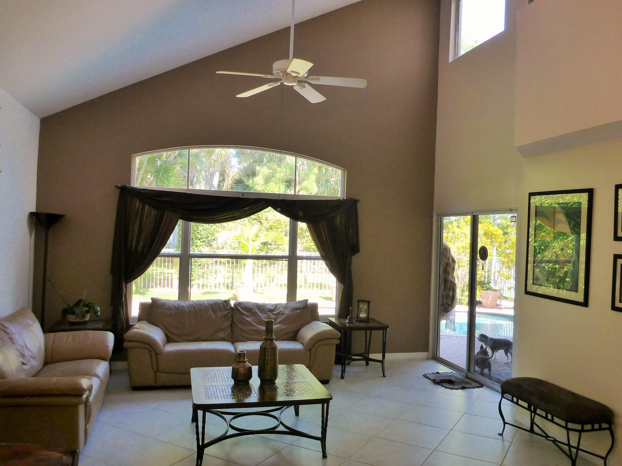 5124 Elpine Way Riviera Beach, FL 33418 - Photo 5 of 45 a living room with furniture and a window