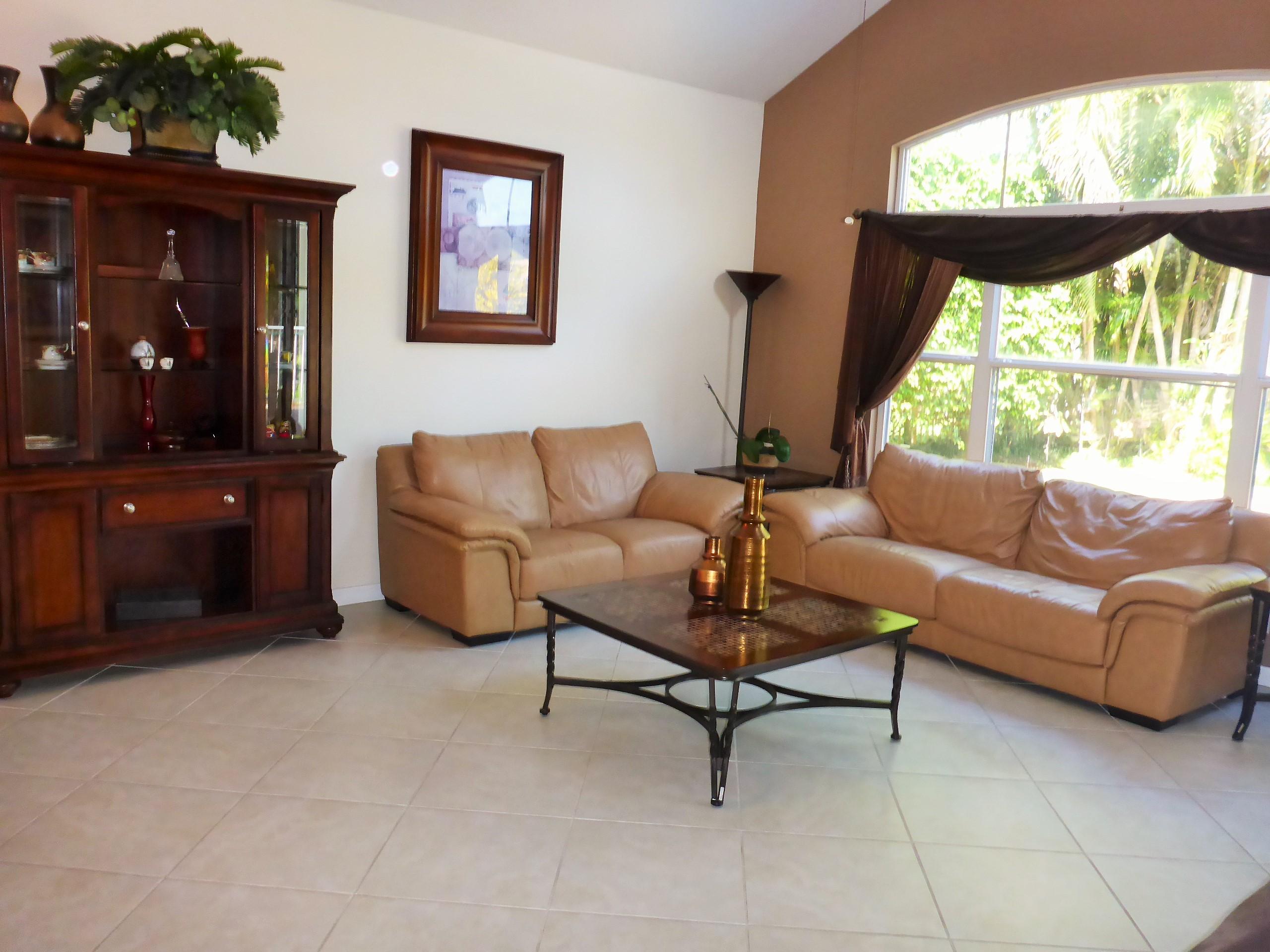 5124 Elpine Way Riviera Beach, FL 33418 - Photo 6 of 45 a living room with furniture and a window