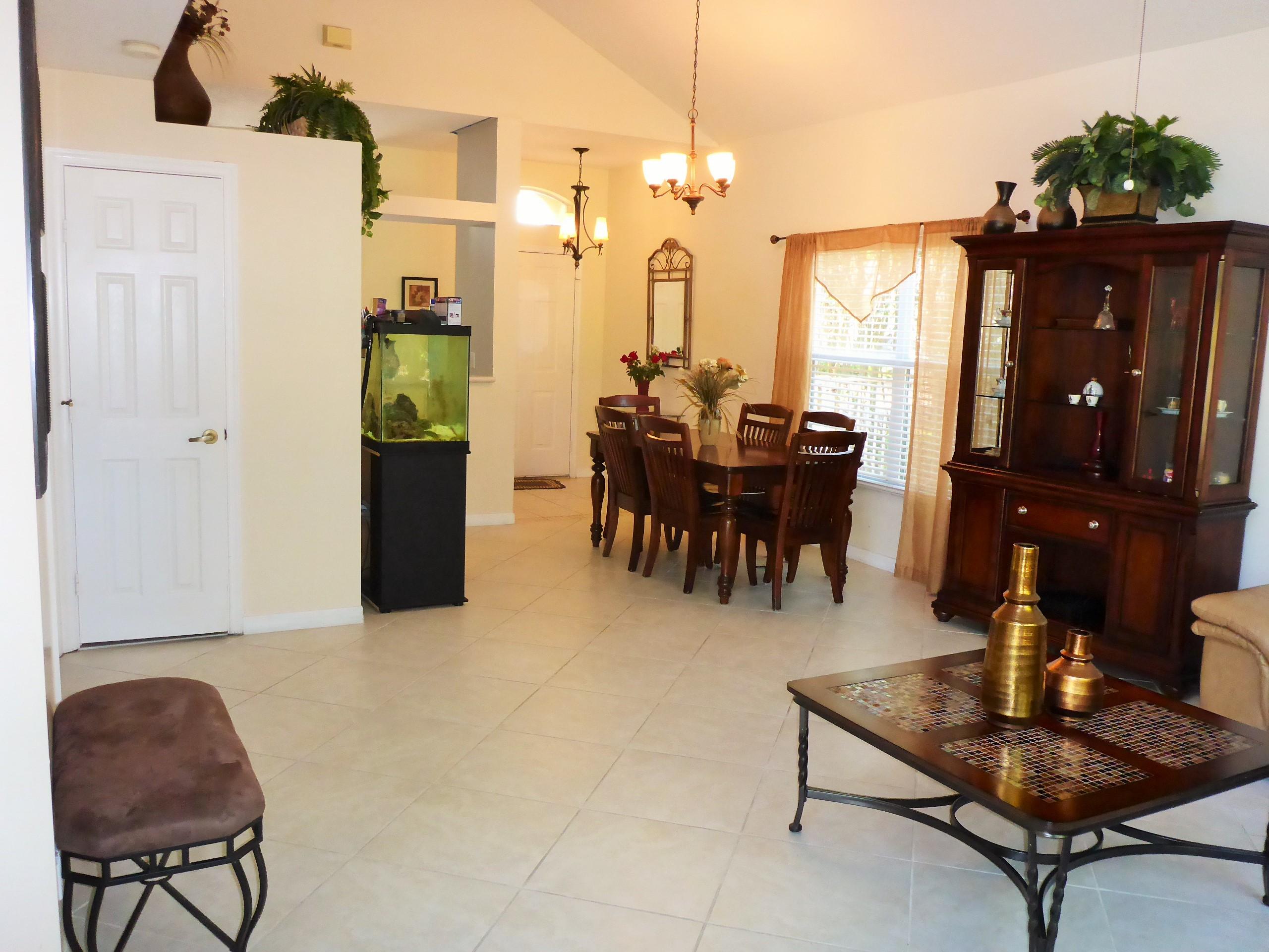 5124 Elpine Way Riviera Beach, FL 33418 - Photo 7 of 45 a dining room with furniture and wooden floor