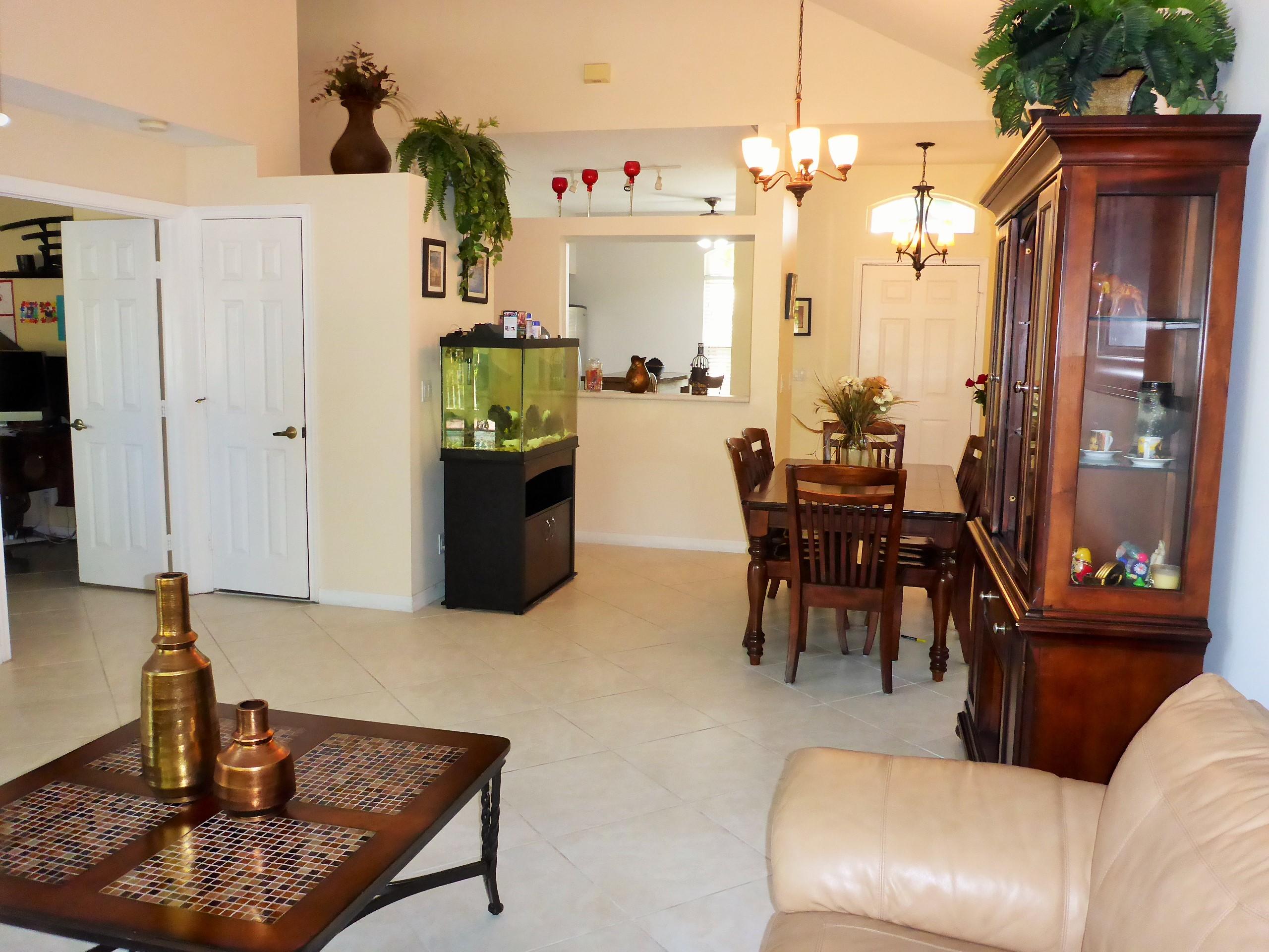 5124 Elpine Way Riviera Beach, FL 33418 - Photo 8 of 45 a living room with furniture and a chandelier