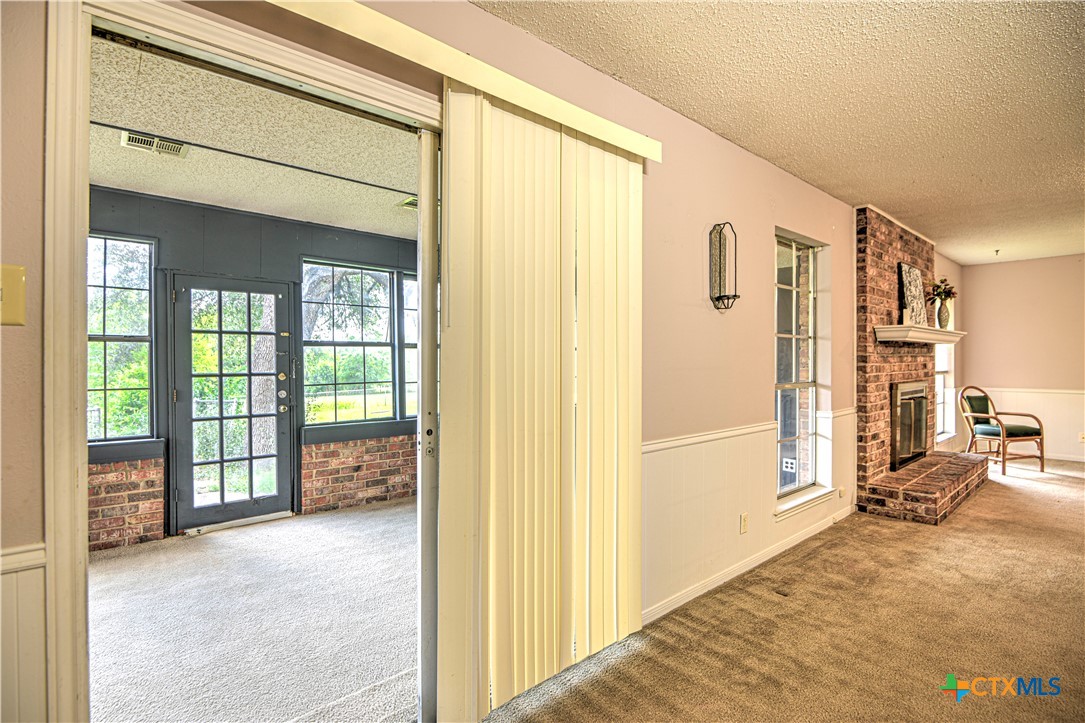 305 Tanglewood Road Temple, TX 76502 - Photo 13 of 46 a view of livingroom with furniture and floor to ceiling window