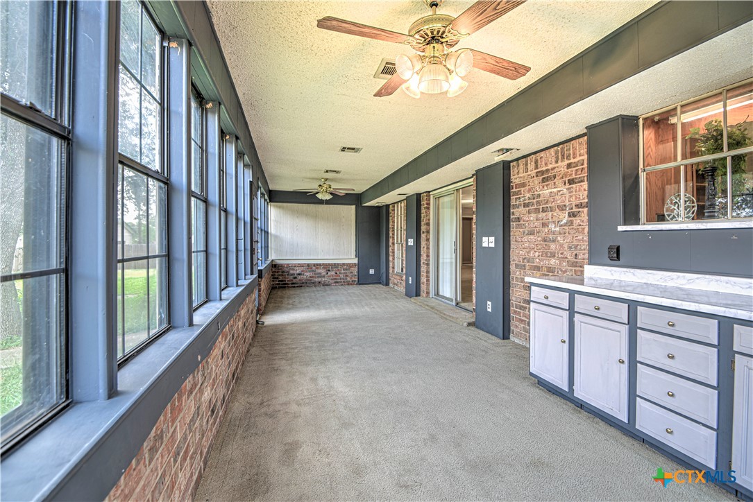 305 Tanglewood Road Temple, TX 76502 - Photo 16 of 46 a view of an entryway with a chandelier